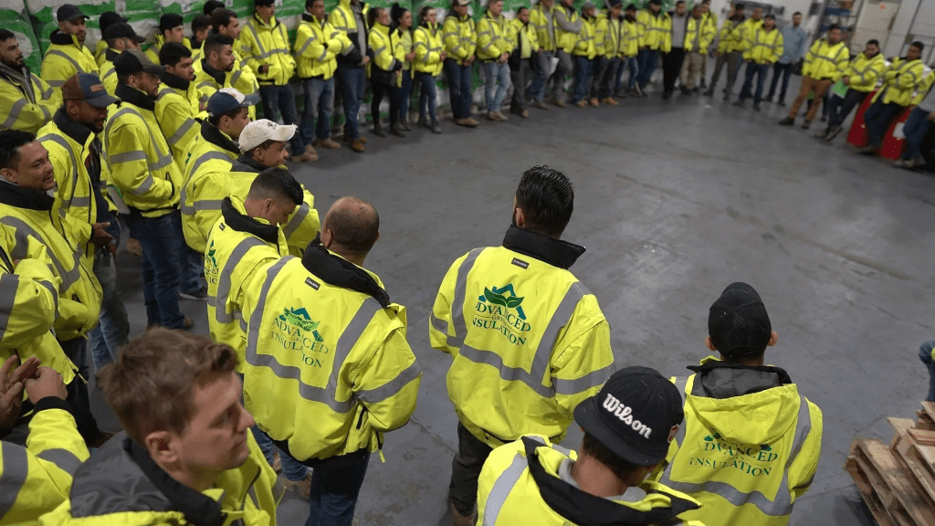 Advanced Green Insulation team forming a circle